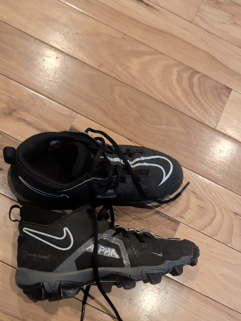 Nike Kids Black Sneakers with Reflective White Swoosh